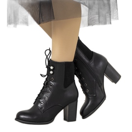 Black ankle boots on the Vedette post