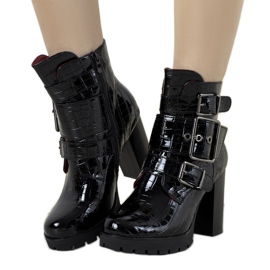 Black patent boots in the Jolie crocodile skin pattern Black patent boots in the Jolie crocodile skin pattern