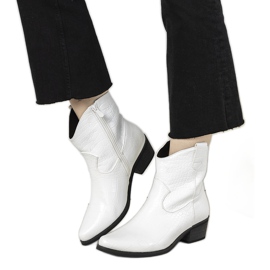 White cowboy boots in the Aurore crocodile skin pattern