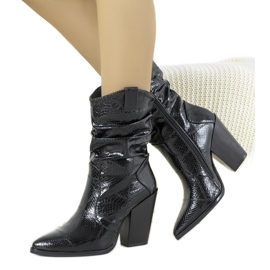 Black cowboy boots in Yolande's snake skin pattern Black cowboy boots in Yolande's snake skin pattern