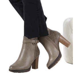 Brown ankle boots on the Heredia post khaki