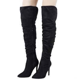 Black thigh-high boots from Arment