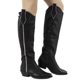 Black boots on the Garay post