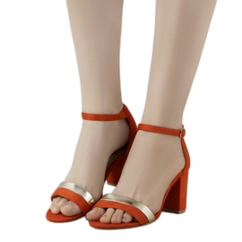 Orange sandals on the Kino post