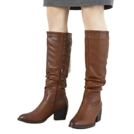 Brown boots on the Landry post