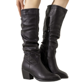 Black boots on the Landry post