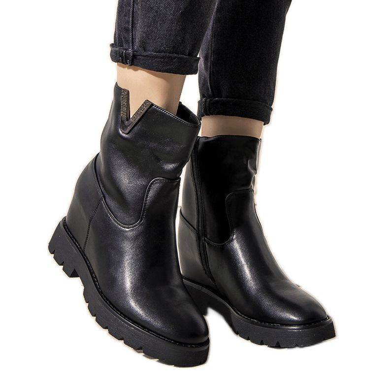 Black women's boots on the Goldie wedge