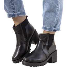 Black insulated boots on the Ruel post