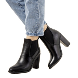 Black insulated boots on the Castro post