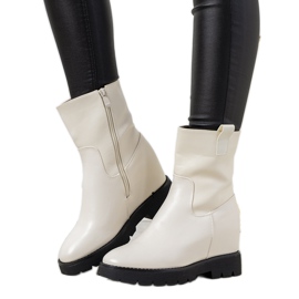 White women's boots on the New Goldies wedge heel