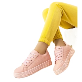 Pink sneakers on the Leonor platform