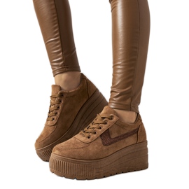 Brown sneakers with a high botanical sole Brown sneakers with a high botanical sole