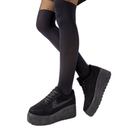 Black sneakers on a high botanical sole