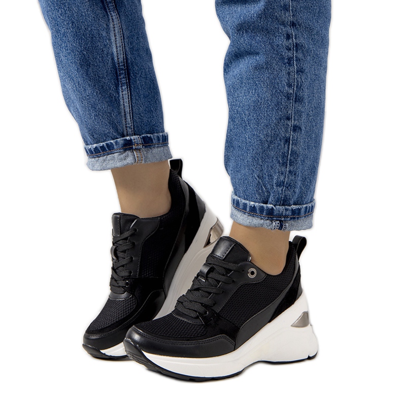 Black sneakers on the Cleveland wedge