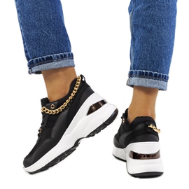 Black sneakers with a chain from Tomas