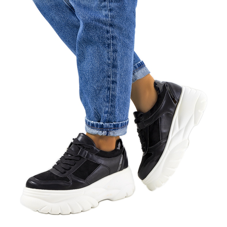 Black sports sneakers with a high Mellis sole
