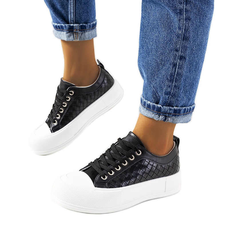 Black sneakers on a thick Luther sole
