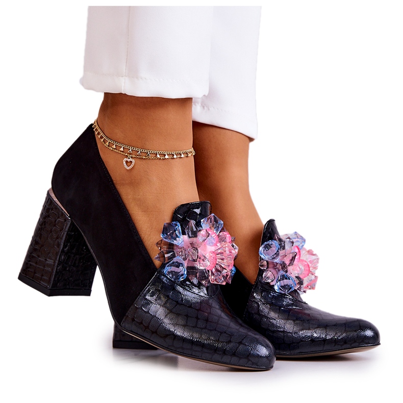 Suede Snakeskin Pumps On A Black Sofa Post