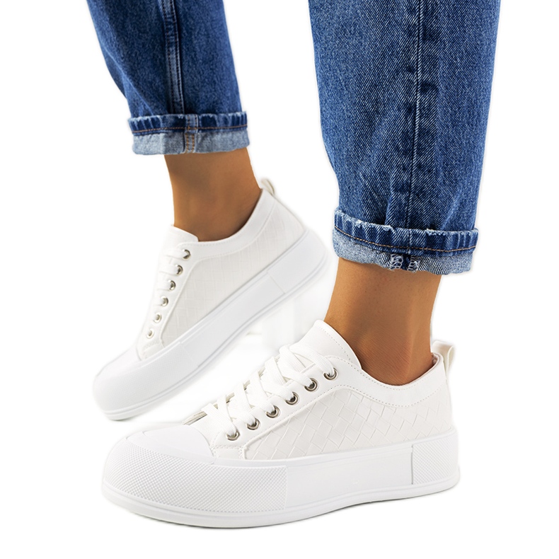 White sneakers on a thick Luther sole