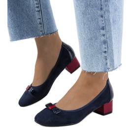 Navy blue pumps with a Deniz bow red