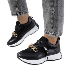 Black sneakers with Samina's chain