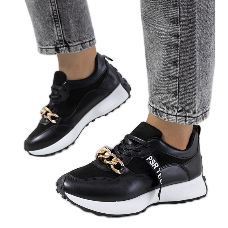 Black sneakers with Samina's chain