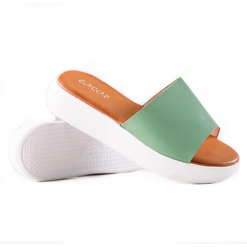 Encor Green flip-flops on the platform