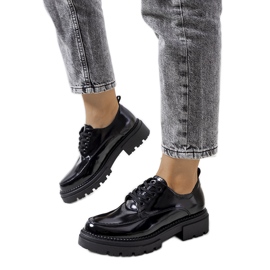Black shoes on a tractor sole from Markus