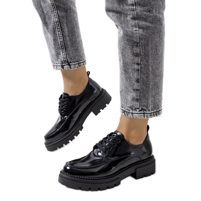 Black shoes on a tractor sole from Markus