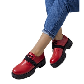 Red shoes on a tractor sole Marike