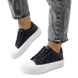 Black sneakers on the Birkett platform