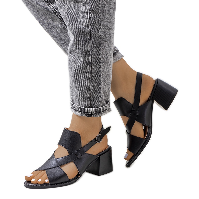 Black leather sandals on the Destina post