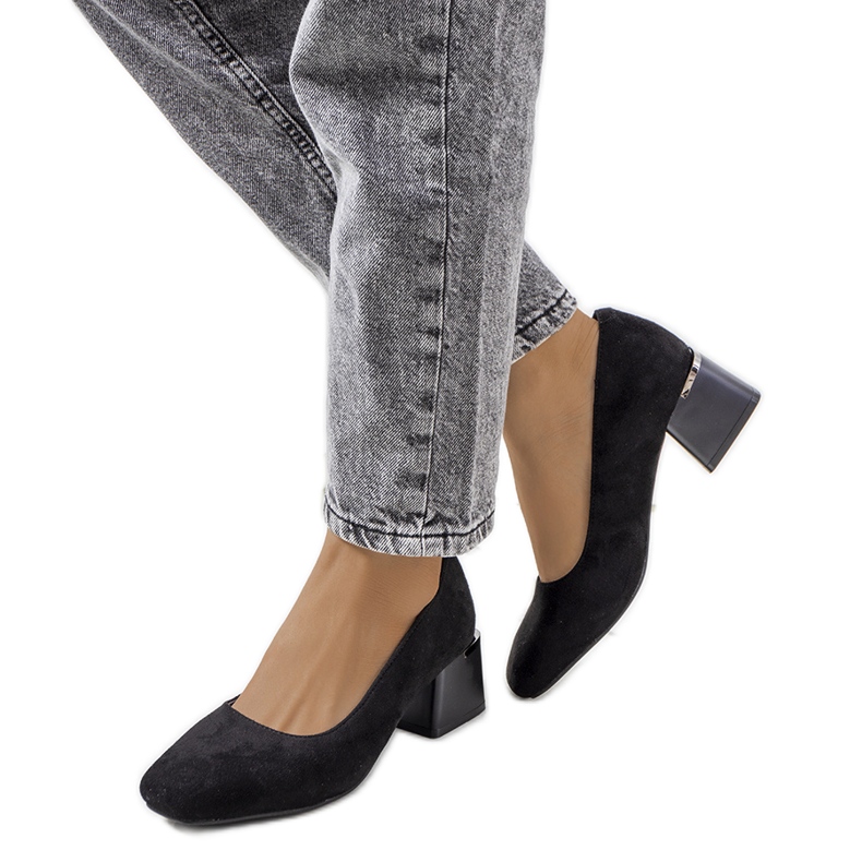 Black pumps on the Bloor post