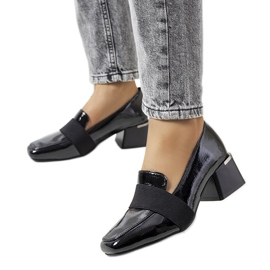 Black lacquered shoes on the Tammy post Black lacquered shoes on the Tammy post