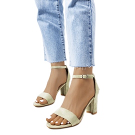 Green sandals on a Karella post