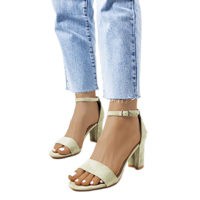 Green sandals on a Karella post