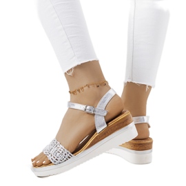 Silver sandals with a decorative Kirk strap Silver sandals with a decorative Kirk strap