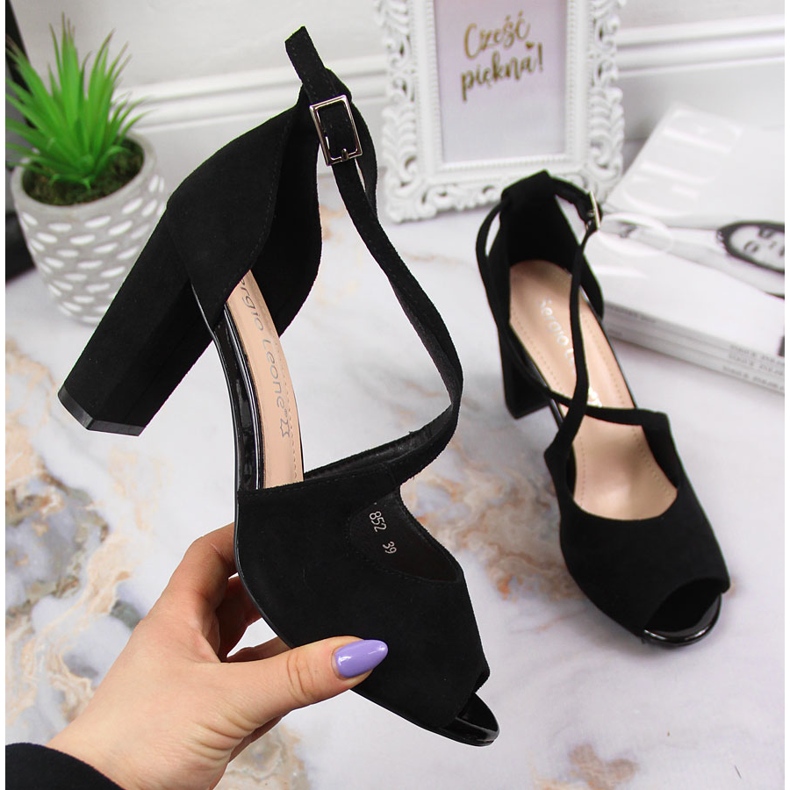 Women's sandals on the black post by Sergio Leone Women's sandals on the black post by Sergio Leone