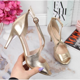 Women's sandals on a gold high heel Sergio Leone golden