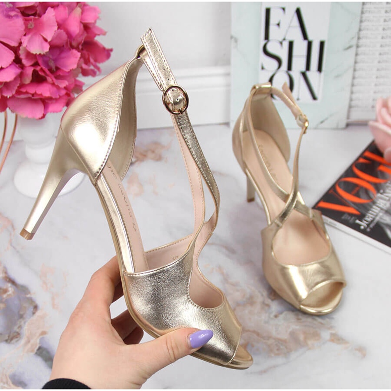Women's sandals on a gold high heel Sergio Leone golden