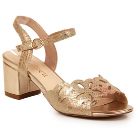 Women's sandals on the gold post by Sergio Leone golden