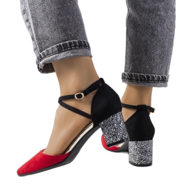 Red and black pumps on the Kittie post