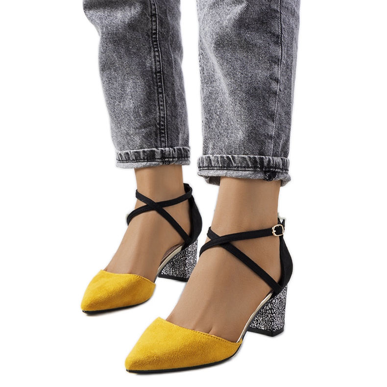Yellow and black pumps on the Kittie post
