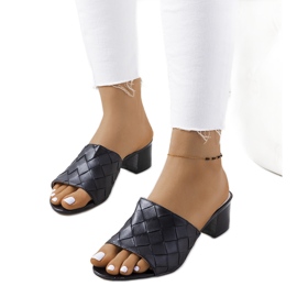 Black braided slippers on the Svila post