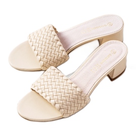 Beige woven slippers on the Verdun post