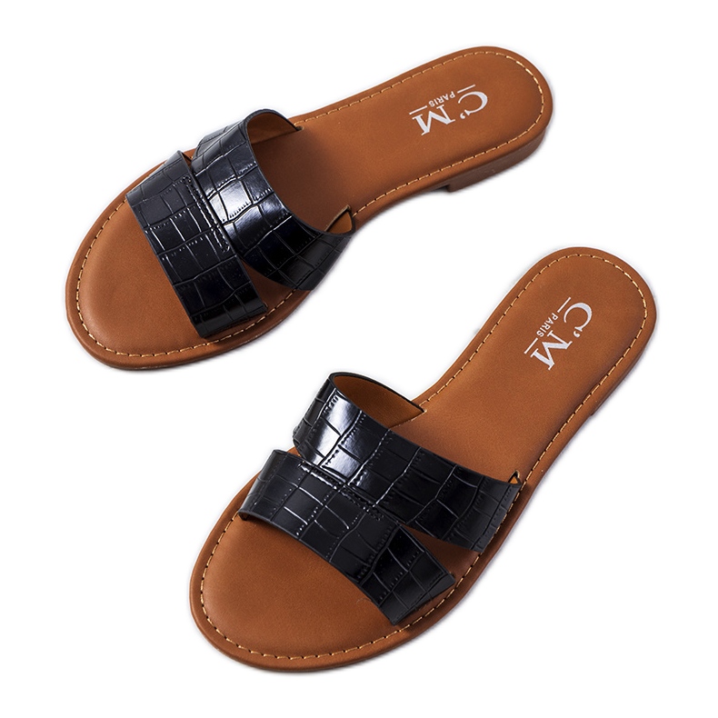 Mila's elegant black slippers