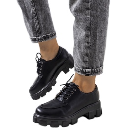 Black shoes on a Feline tractor sole