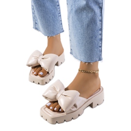 Beige slippers on the Platt tractor sole