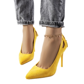 Yellow heels with decorative Anthe cutouts Yellow heels with decorative Anthe cutouts