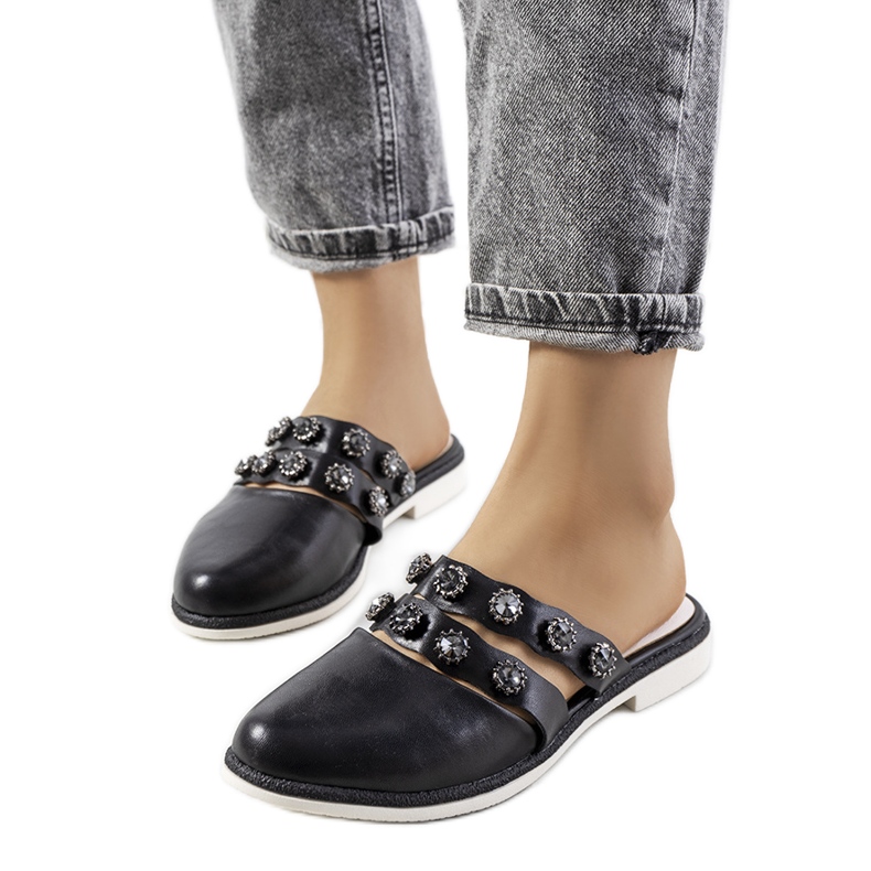 Black slippers decorated with Asselt studs Black slippers decorated with Asselt studs